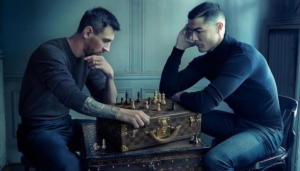 Photo of Lionel Messi and Cristiano Ronaldo playing chess, taken by Annie Leibovitz.