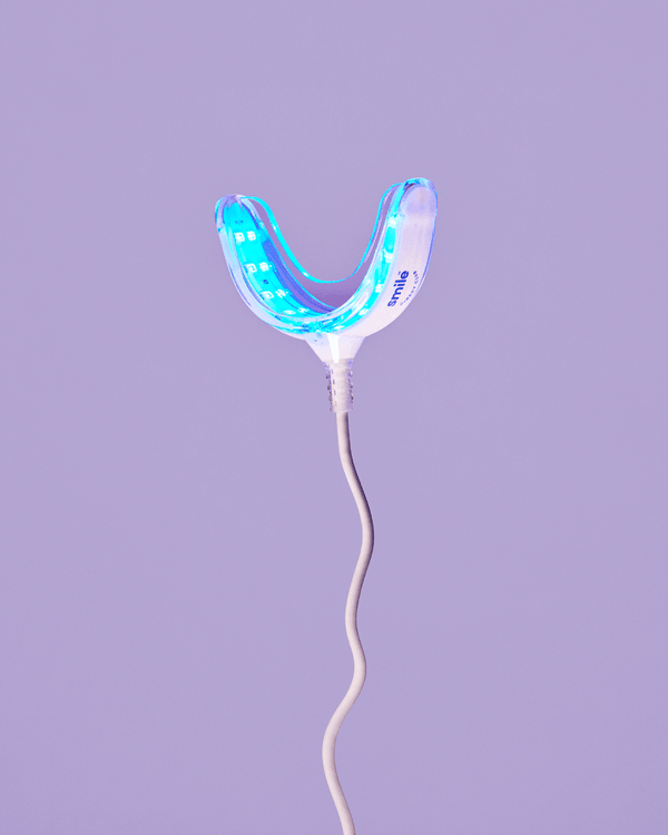 Moving image by Nicolle Clemetson of a glowing mouth retainer, with lights blinking on and off to demonstrate.