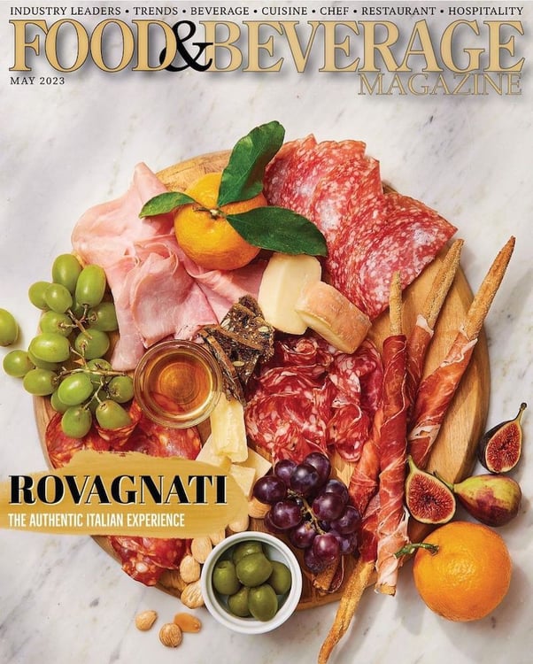 Tear sheet magazine cover of Rovagnati product shoot with cured meats, green olives, rosemary, grapes, oranges, figs, almonds, and cheese, by Brooklyn-based food/drink photographer Trevor Baca.charcuterie board, by Brooklyn-based food/drink photographer Trevor Baca.