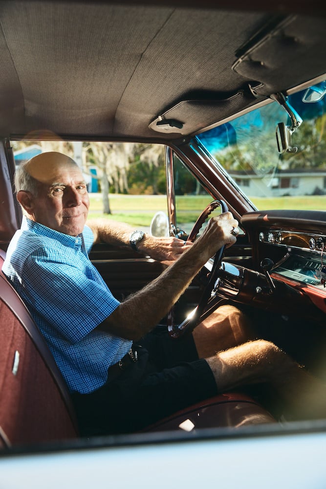 Portrait of man seat contentedly in classic car, by Altamonte Springs, Florida-based portrait photographer Brian Carlson.