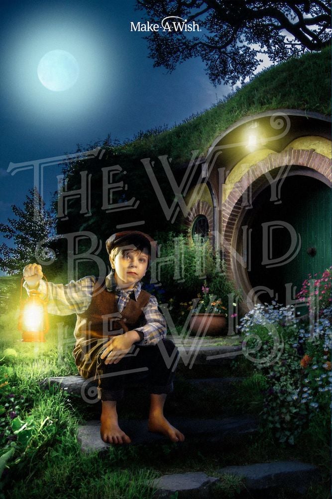 Photo of wish kid as hobbit seated outside of hobbit hole on hillside, with lantern on a moonlit evening, by Miami-based portrait photographer Sonya Revell.