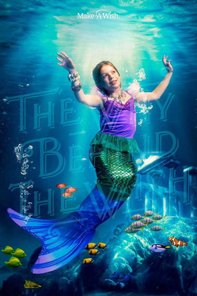 Image of wish kid as child mermaid floating dreamily with fishes under the sea, Miami-based portrait photographer Sonya Revell.