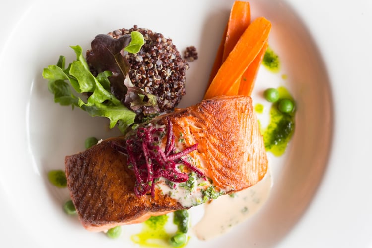 Photo by Tegra Stone Nuess of an ornate plate of salmon.