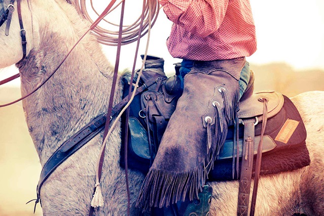 Portrait of mounted rancher by portrait photographer George Kamper, shot in Moab, Utah. 