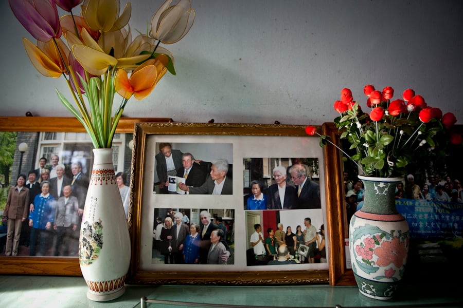 Amanda Mustard's photograph of survivor's mantel of family photos