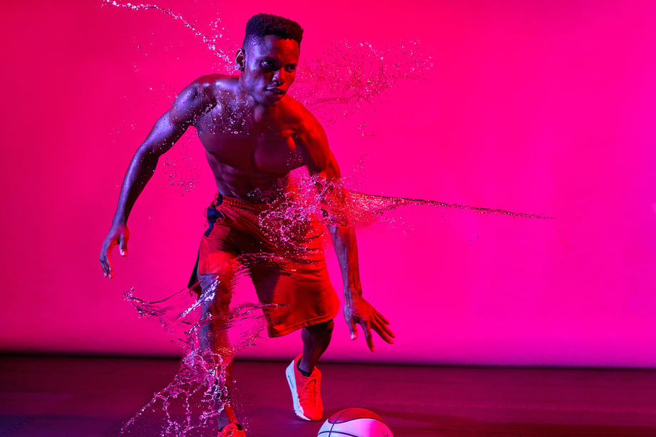 Ricky Kluge's shooting of shirtless male athlete being strategically splashed with water