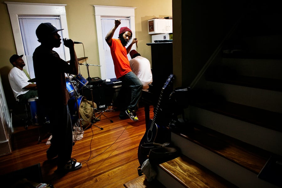 Image of rappers practicing in a living room in Raleigh, North Carolina.