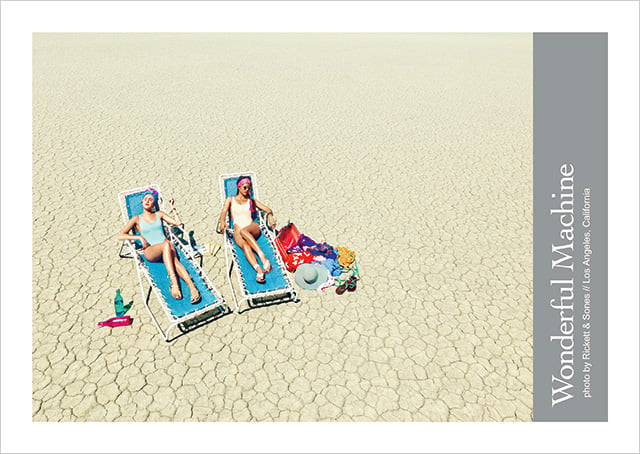 WM promo landscape photo by Rickett & Sones of girls sunbathing in desert