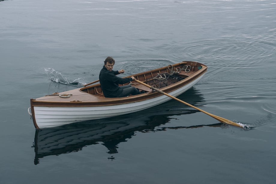 Mackenzie Duncan captures a photo of Simon Whitefield rowing his boat