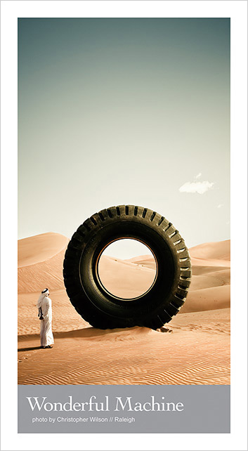 Portrait photo by Christopher Wilson of a large tyre in the desert 