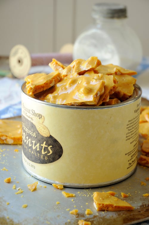 still life photography of a can of peanut brittle