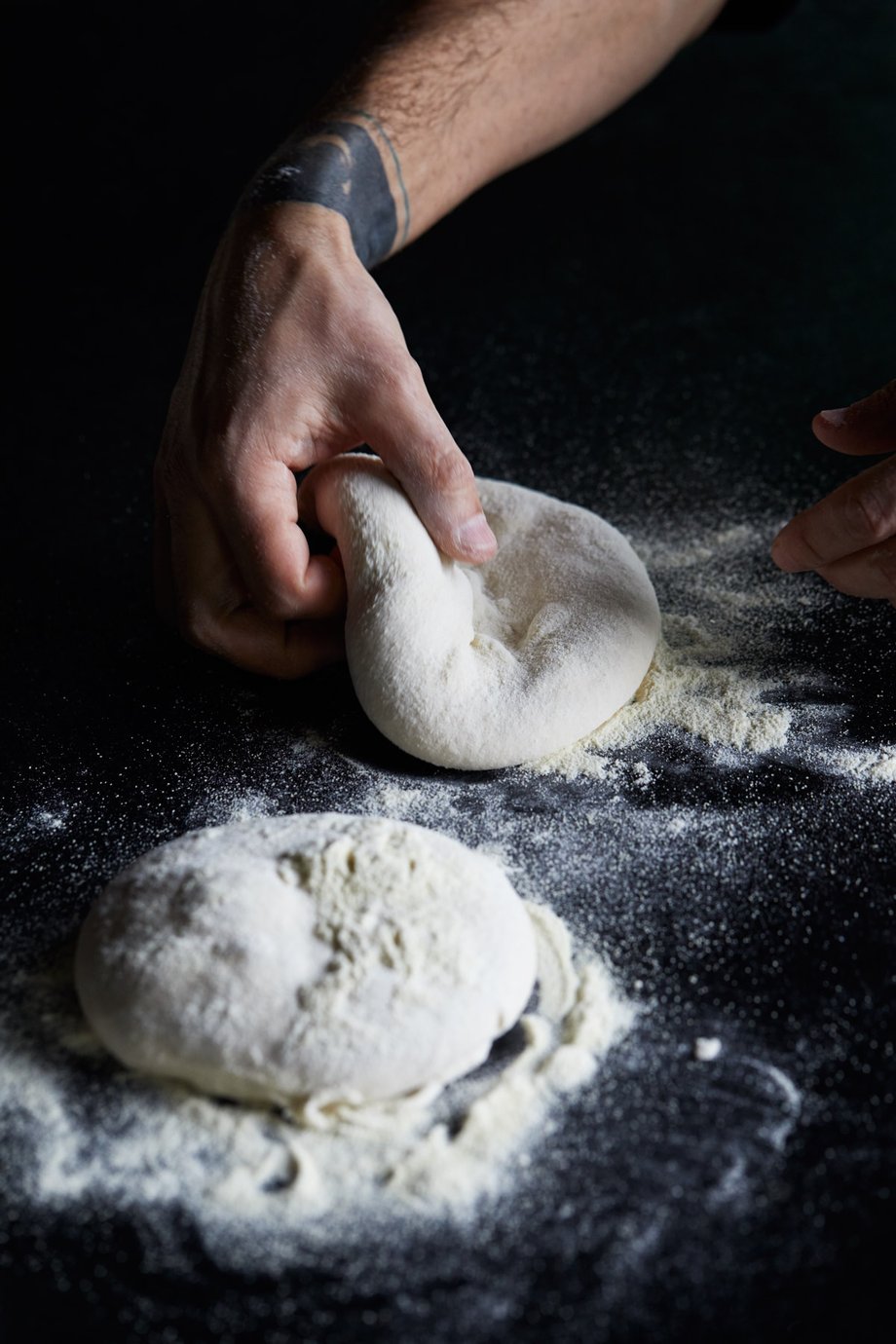 Jody Horton's shot of a kitchen employee kneading dough