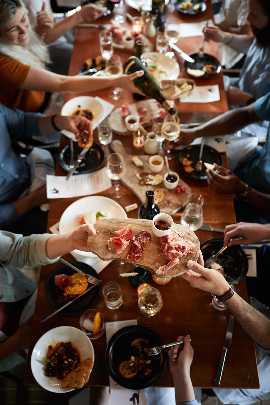 Jody Horton catches the festivities from above: a table full of food, wine, and people