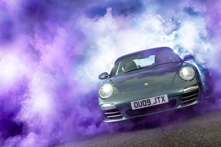 Porsche 997 with swirling green smoke by Darren Woolway