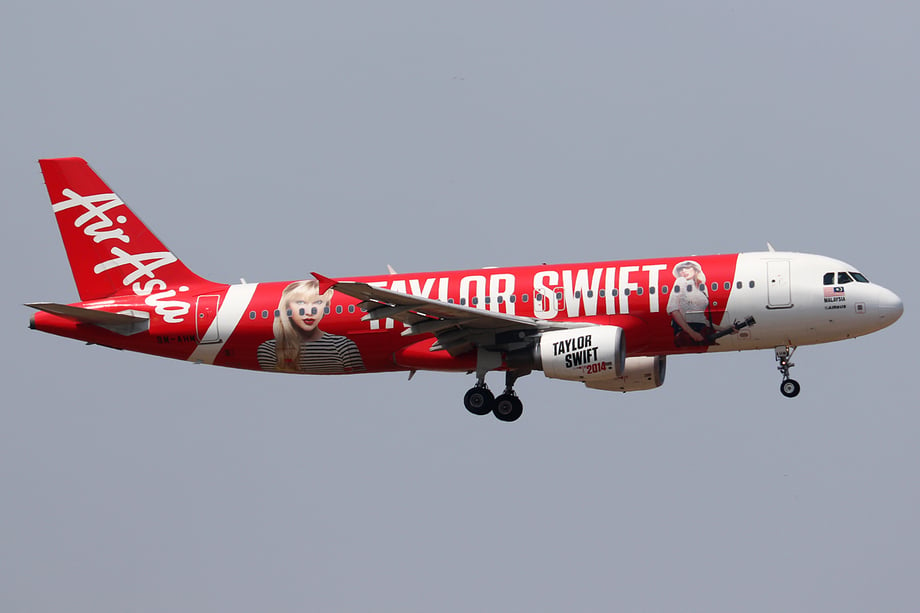 Christie Goodwin's photos of Taylor Swift adorn the side of a red Air Asia a320 aircraft