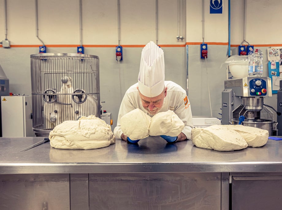Alberto Bernascone photographs legendary chef Vincenzo Santoro inhaling his dough for the Washington Post