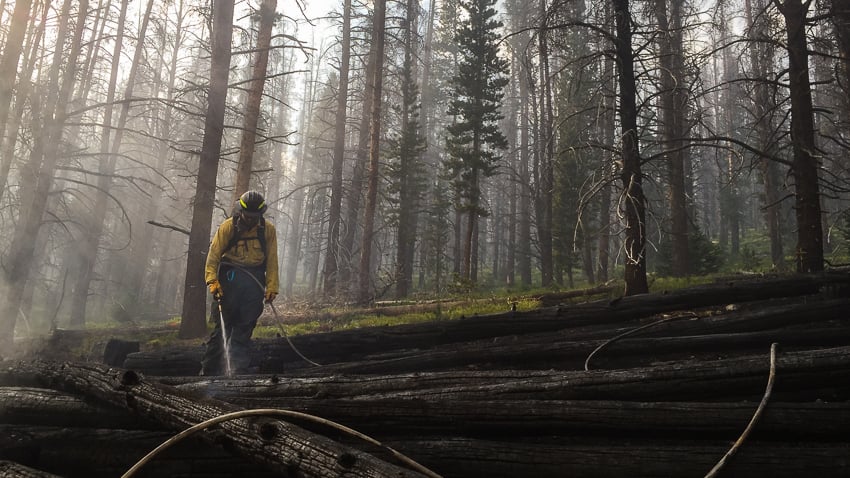 Photographer Blake Gordon Captures Johnny Tulare mops up embers on the Keystone Fire in southern Wyoming on July 4th, 2017.