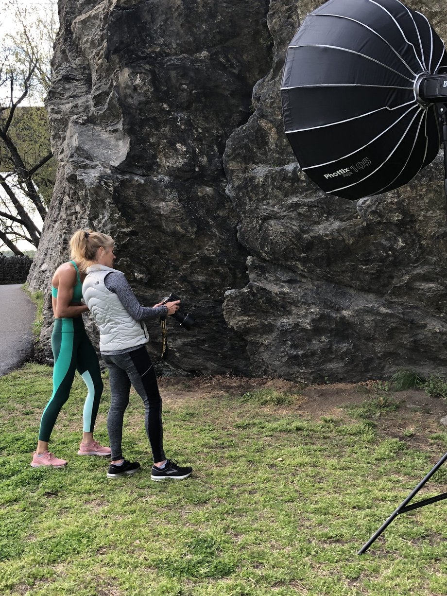 Behind the scenes photo of Cat and Julia Lehman looking at a shot on the camera screen