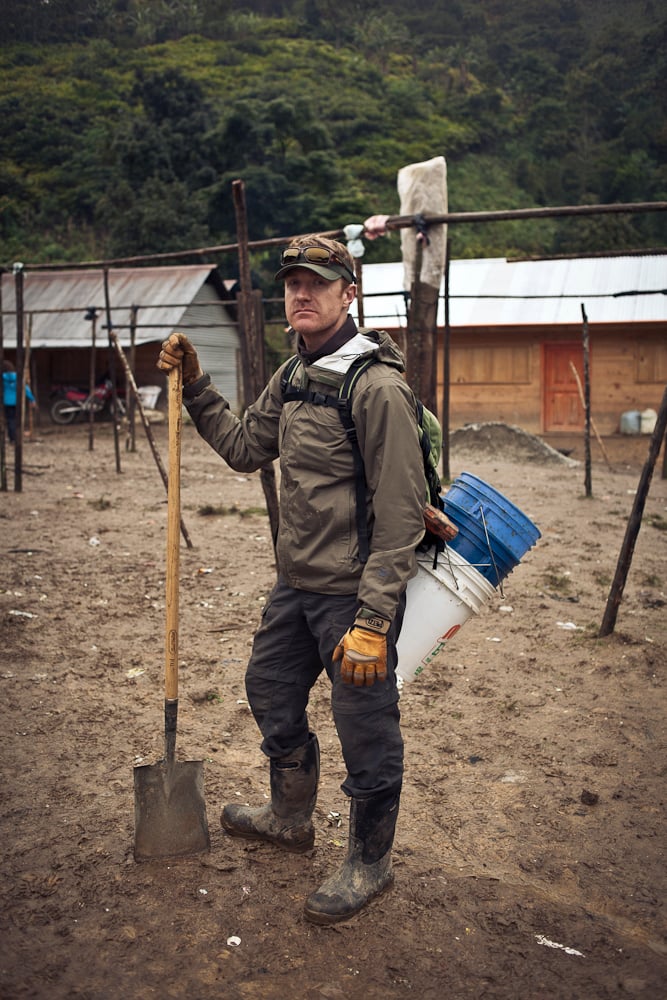 Engineer standing with a shovel in a Mayan Village of Guatemala shot by Nashville, Tenn.-based industrial photographer Hollis Bennett