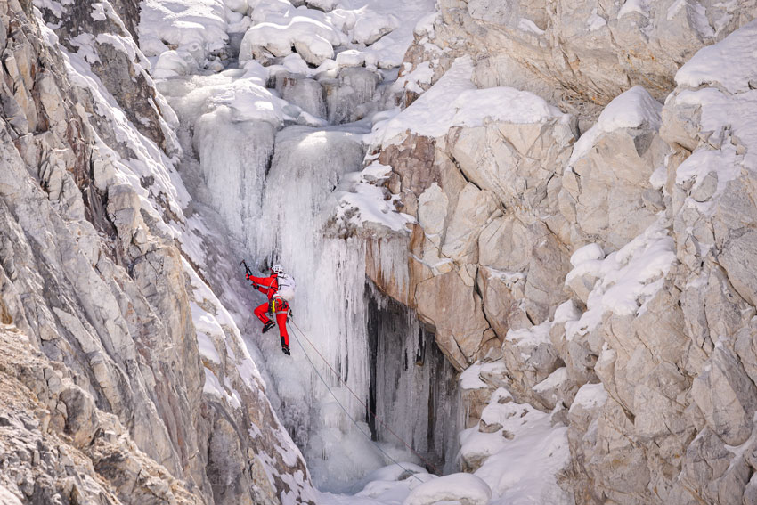Blake Gordon captures a climber for The North Face as they scale the icy mountainside.