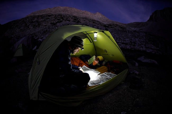 Commercial photography showing a backpacker in a tent shot by Matt & Agnes Hage for Black Diamond Equipment 