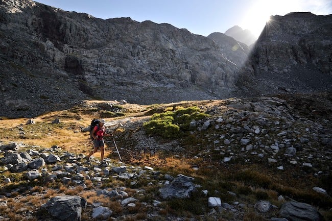 Adventure photography of a backpacker moving through The Sierra High Route 