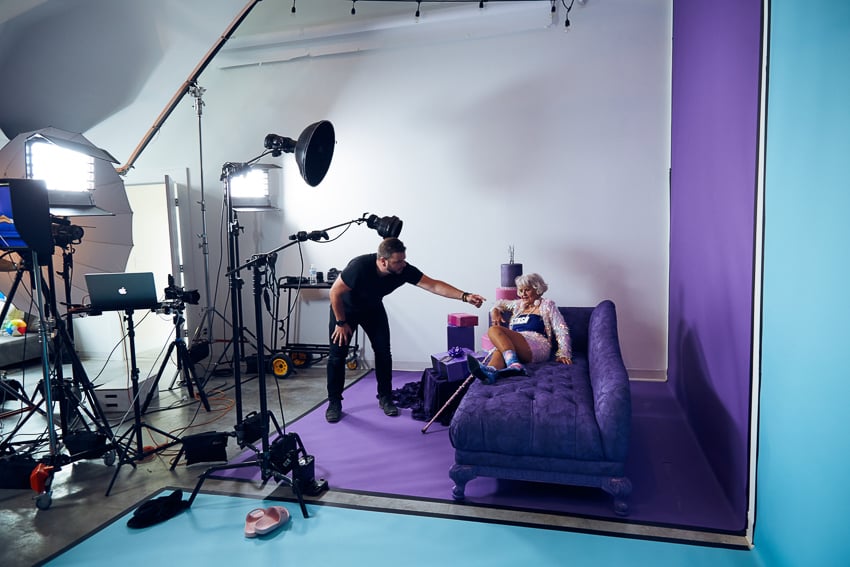 Clay Cook directing Instagram star Baddie Winkle during a shoot for Stash Investing.