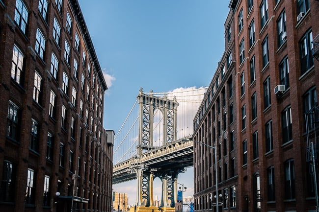 The Brooklyn Bridge seen at the end of a classic New York street, photo by Chris Sorensen