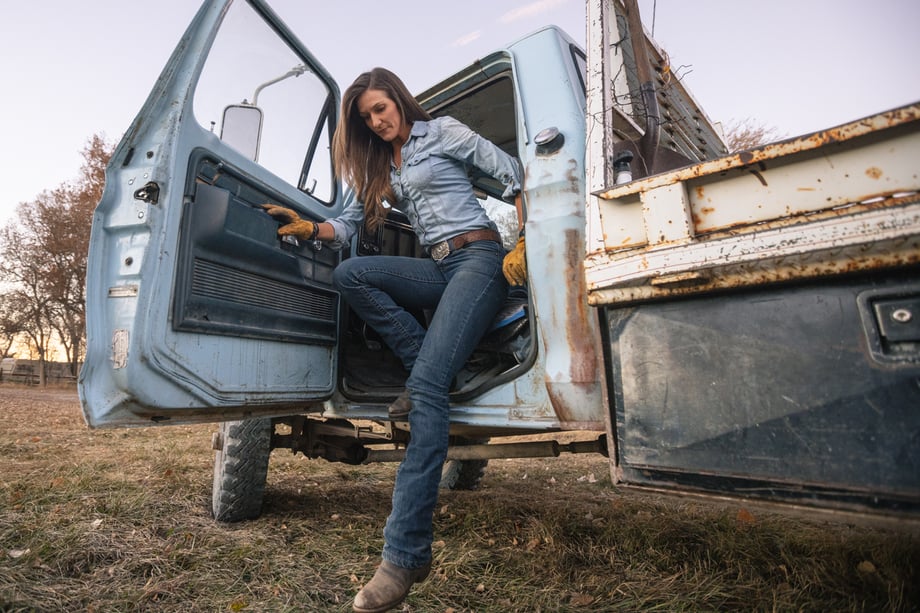 Craig Okraska photographs a woman climbing out of her pick up truck for the LOR Foundation