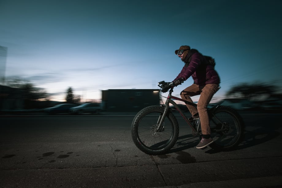 Craig Okraska photographs a man at dusk zooming by on his bike for the LOR Foundation
