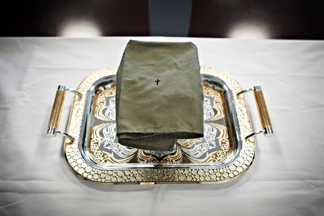 Embroidered napkin on gold serving tray shot by New York-based freelance photojournalist Sebastiano Tomada for Reader's Digest