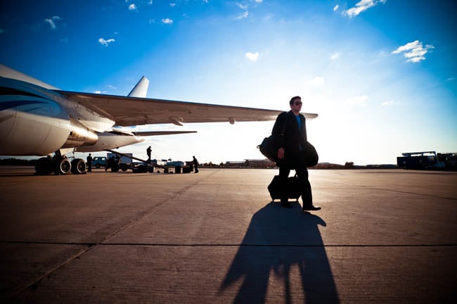 Image of a team member walking away from a private jet, shot by Dallas-based portrait photographer Trey Hill for Dallas Stars