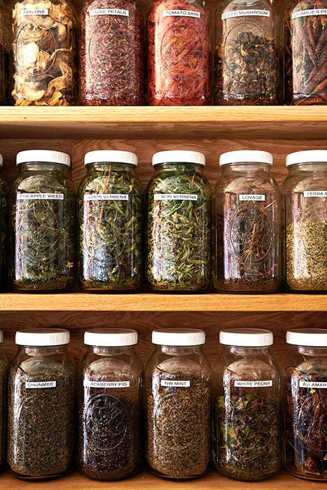 Dina Avila takes close up image of spices in jars for Fermenter