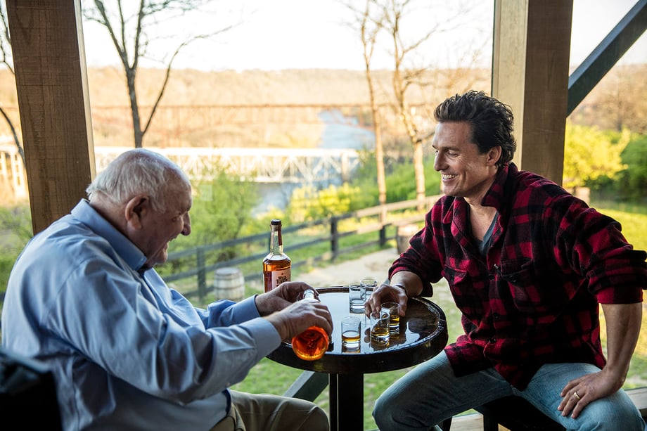 Fernando Decillis photographs Matthew McConaughey and Wild Turkey distiller Jimmy Russell sharing whiskey.