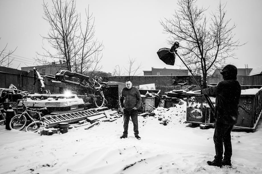 James Breeden shares a Black and white behind the scenes shot of lighting Newell in his scrapyard