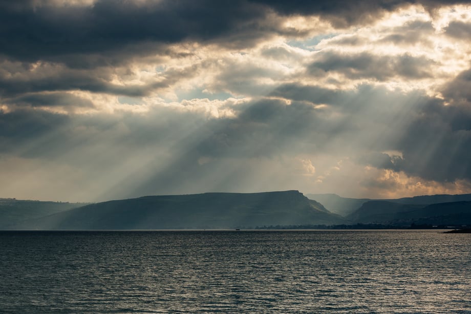 David Vaaknan provides a view of the Sea of Galilee with sun streaming through the clouds