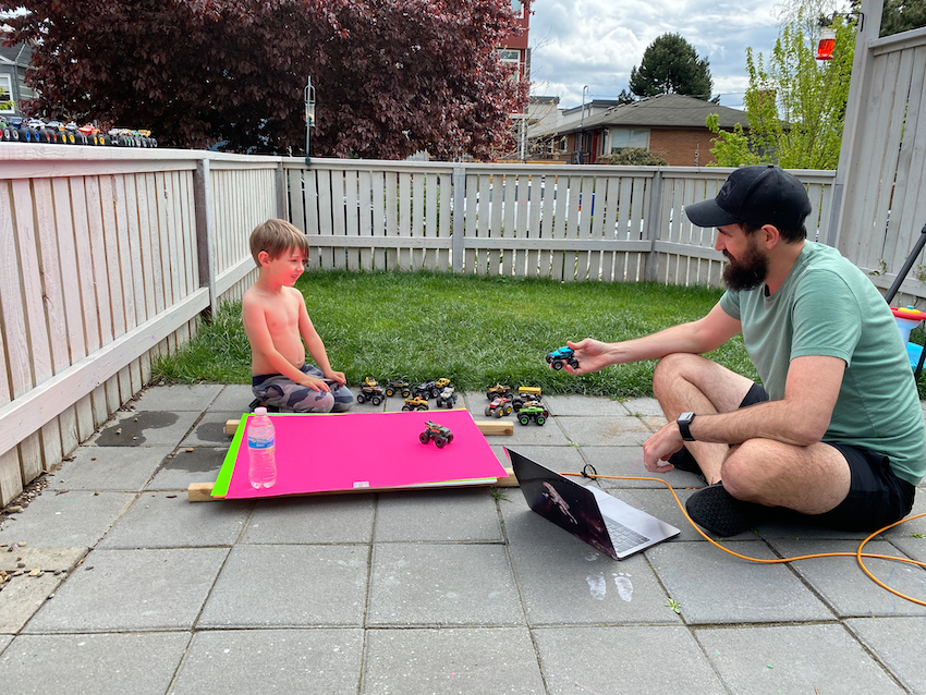 Photo of Geo and Ryatt working on the Monsters project in their front yard.