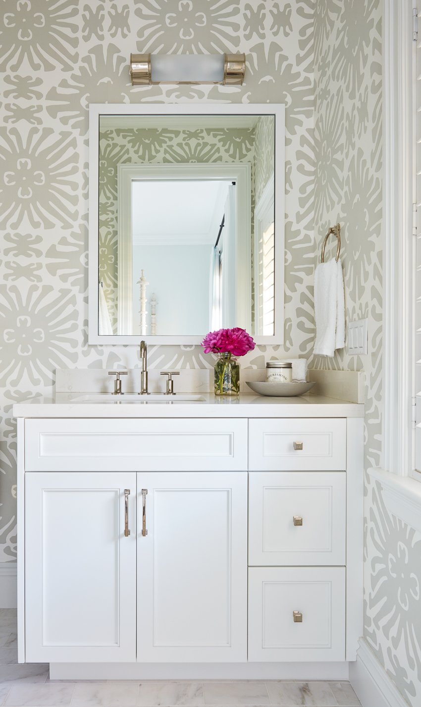 White wallpapered bathroom shot by Carmel Brantley