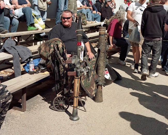 Man on bench with personal arsenal shot by Nashville, Tenn.-based lifestyle photographer, Hollis Bennett