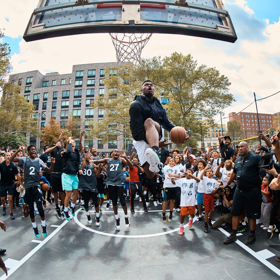 Johnnie Izquierdo's full color shot shows the amazement of a crowd of kids as Zion Williamson makes a difficult dunk