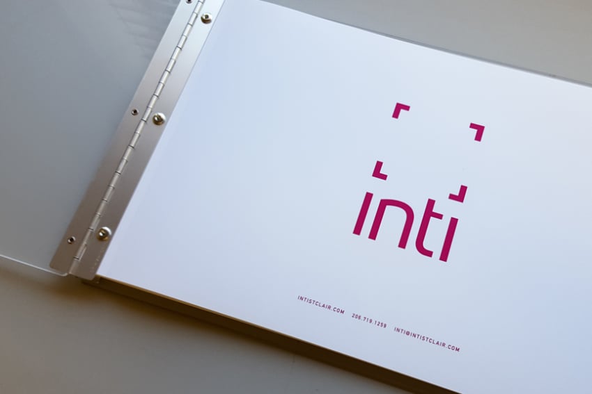 Inti St. Clair's portfolio opened to the first page, displaying her personalized logo.