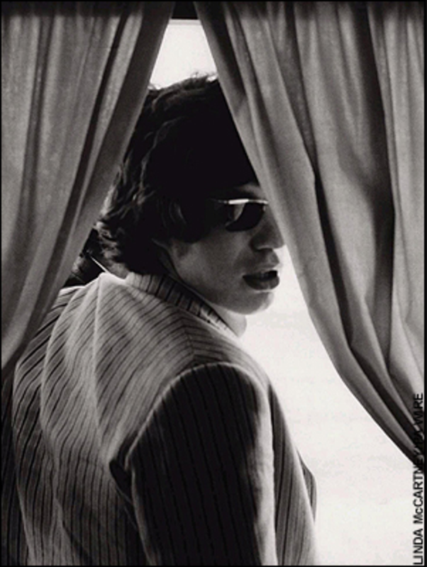 Linda McCartney's 1966 shot of Mick Jagger looking over his shoulder through a set of curtains