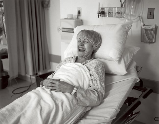 Lynn Redgrave Laughing In a Hospital Bed shot by Seattle-based documentary photographer Annabel Clark