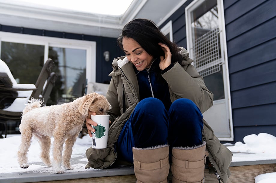A candid moment between Karen Olivo and her dog. Photographed by Lauren Justice for The New York Times. 