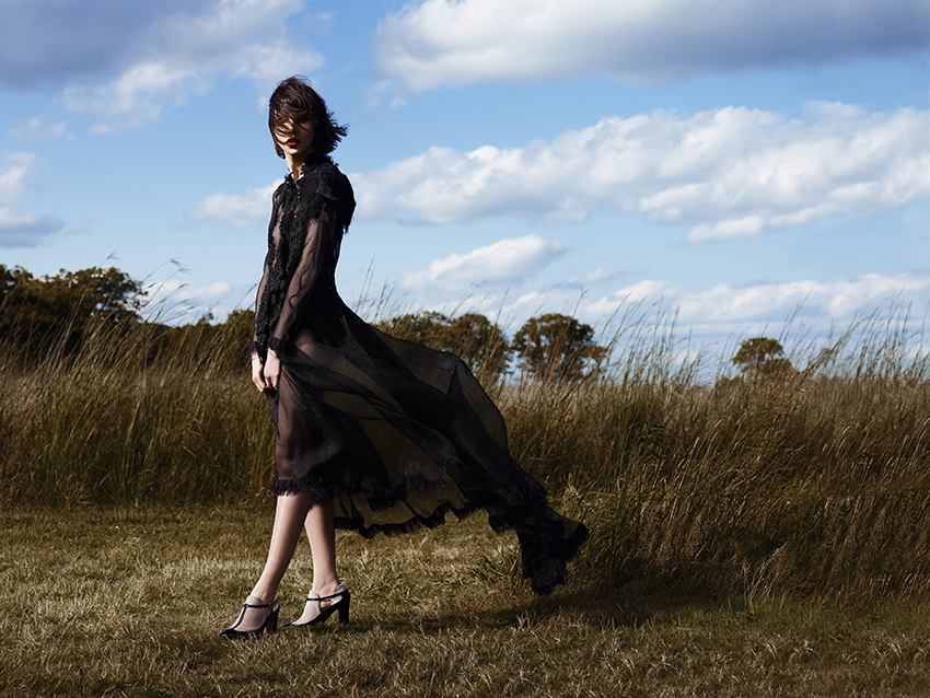 Luke Schneider's photo of a model in a field in a flowing outfit