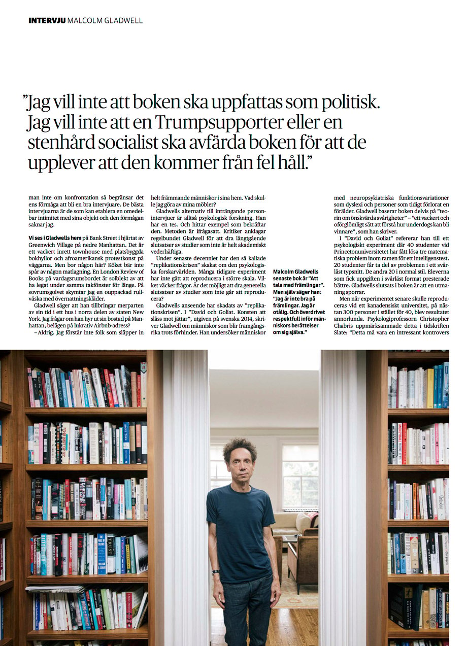 Tear sheet of Malcolm Gladwell standing in a doorway of his office.