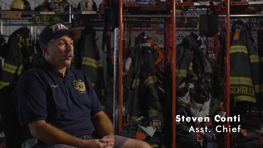 Josh LeClair's photo of Steven Conti, the Assistant Chief, as he sits and talks in the firehouse