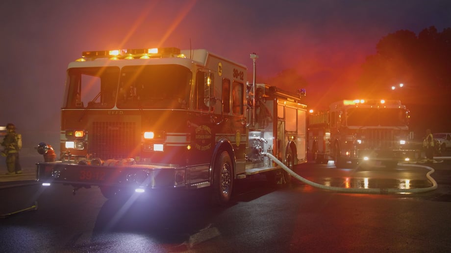 Josh LeClair's photo shows two trucks with hoses engaged at night, with flashing lights