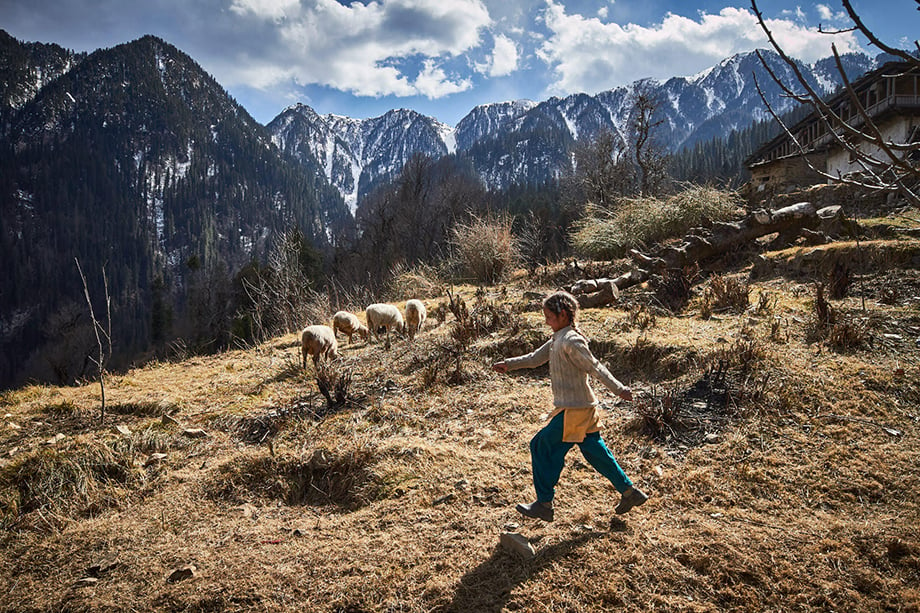 Mark Katzman’s Real and Raw Travels through India for FES - Young girl skipping in the Himalayas.