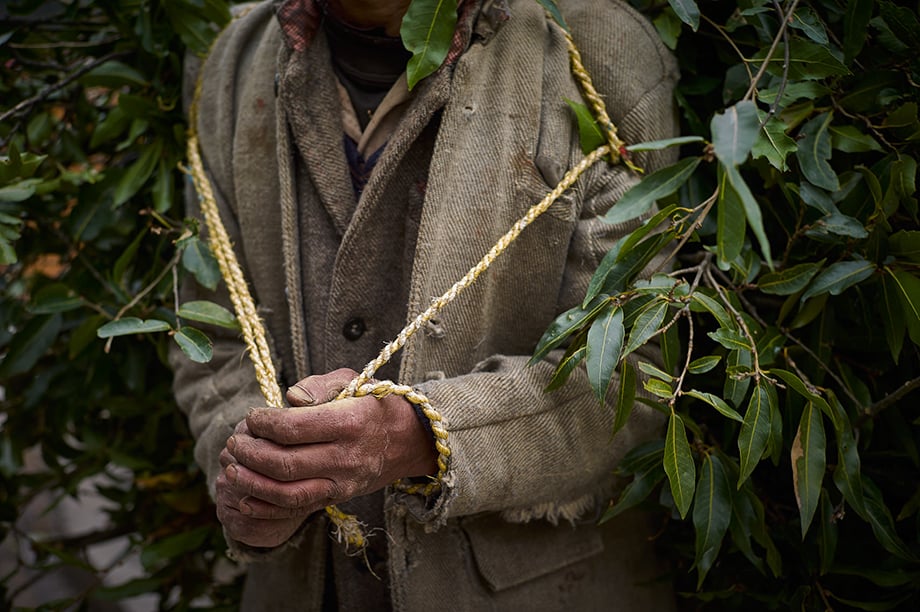 Mark Katzman’s Real and Raw Travels through India for FES - A man holds rope. 